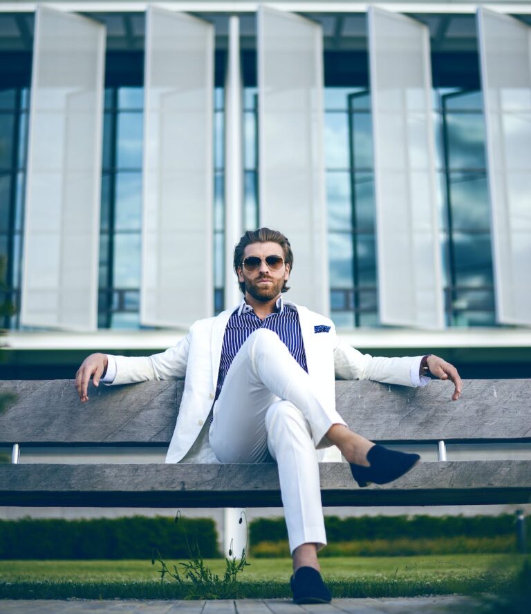 man wearing white suit jacket and white pants